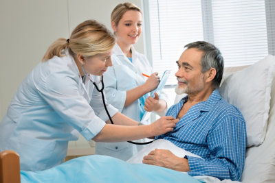 doctor checks the health condition of senior man